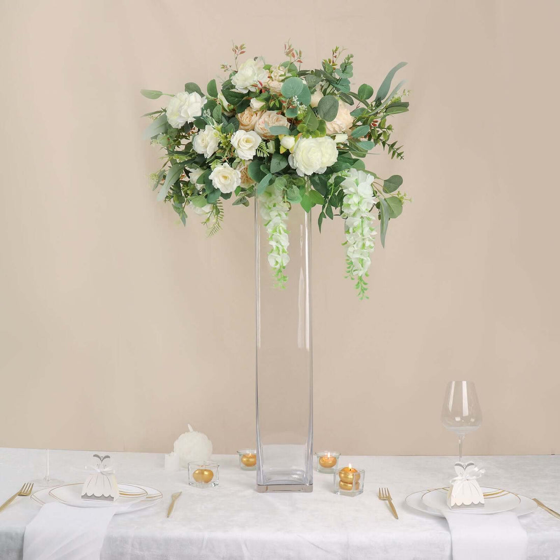 Elegant floral arrangement in a tall vase for table decoration.