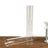 Clear glass cylinder vases on a wooden surface.