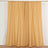 Yellow curtain panels hanging on a rod.