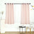 Soft pink curtains draping over a sheer panel in a modern living space.