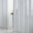 Lightweight sheer curtains draping elegantly in a bright room.
