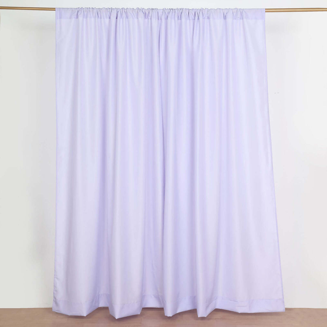 Lavender curtain panel on a plain backdrop