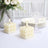 White bubble candle set on a table with elegant tableware and floral arrangement.