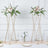 Floral arrangements on gold stands for elegant table decor