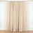 Beige curtain panel with gathered top on a plain backdrop