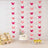 Decorative butterfly garland with cake and desserts for a festive celebration.