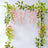 Pink flower garland with green leaves, perfect for decoration