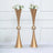 Gold flower vases with white and pink flowers on a table
