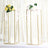 Gold floral display stands with candles and flowers on a sparkling backdrop.