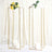 Elegant gold candle holders adorned with flowers, perfect for event decor.