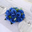 Blue artificial rose centerpiece arrangement for table decor.