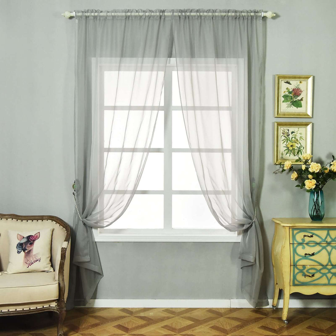 Sheer gray curtains elegantly draped in a stylish living room setting.