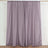Purple curtain panels on a plain background for elegant window decor.