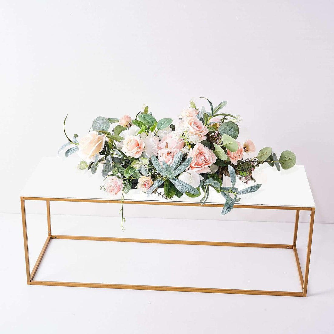 Floral arrangement on a modern table with gold accents