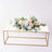 Floral arrangement on a modern table with gold accents