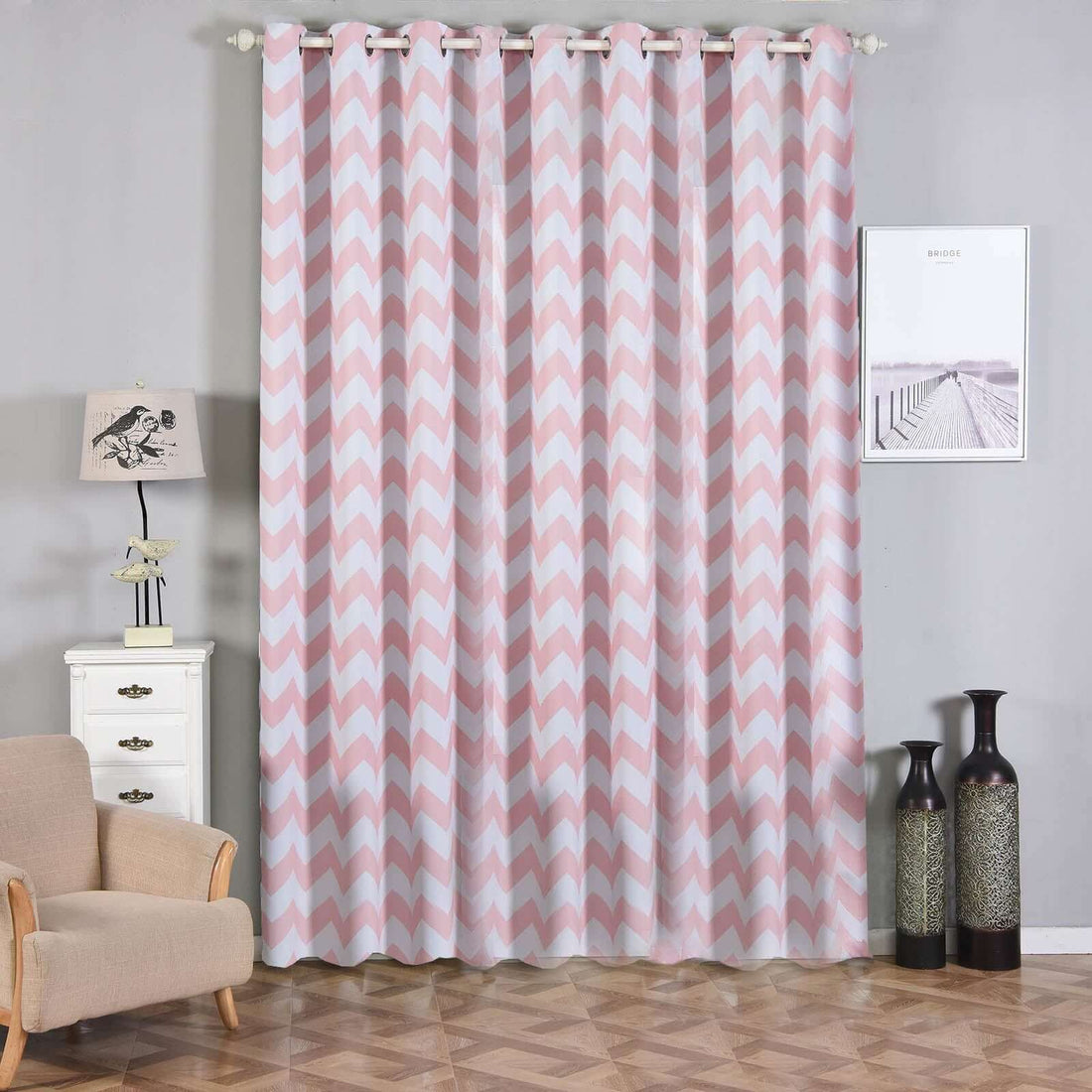 Pink chevron pattern curtains hanging in a stylish living room setting.
