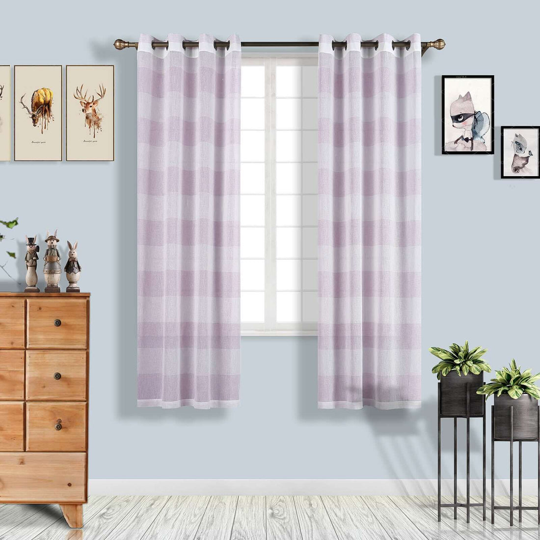Sheer purple checkered curtains hanging in a bright room.