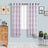 Sheer purple checkered curtains hanging in a bright room.