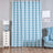 Blue chevron patterned curtain in a stylish living room setting.