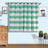 Green and white striped curtains hanging in a styled room.
