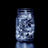 LED fairy lights in a glass jar against a dark background. #whtbkgd