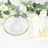 Clear glass bowl with gold rim, surrounded by floral decor and elegant utensils.
