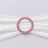 Pink rhinestone circular brooch on white fabric ribbon