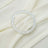 Silver crystal bangle on soft cream fabric.