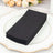 Stack of black paper napkins on a decorative plate.
