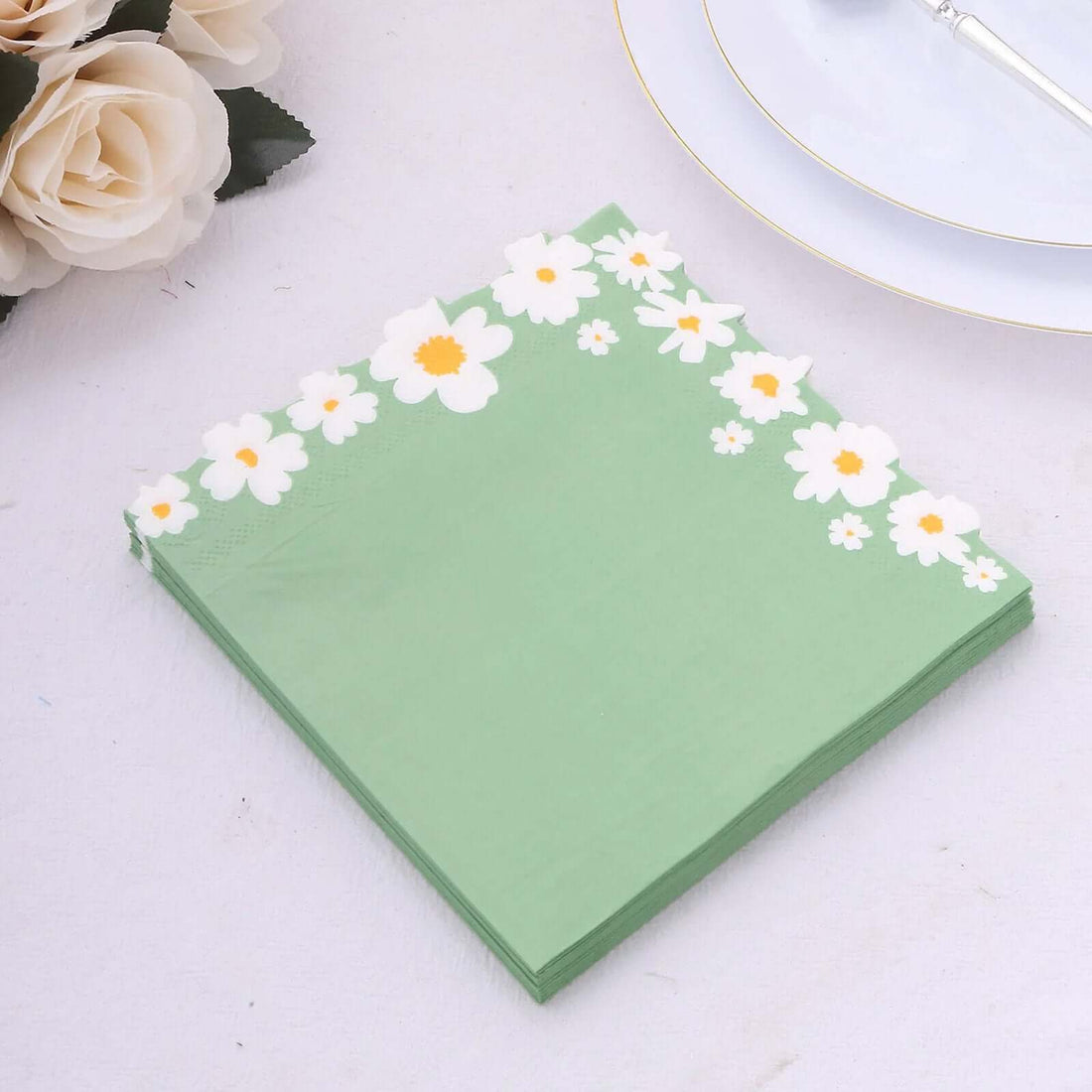 Green napkins with floral design on edges, perfect for events or dining.