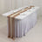 Elegant table setup with soft draping and glassware for events.