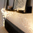 String lights elegantly draped on a shelf, enhancing cozy home decor.