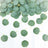 Green herbal leaves scattered on a white background