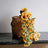 Woven basket with sunflowers cascading over a marble countertop.