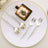 Elegant dessert plate with silver cutlery and gourmet cake.