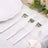 Three elegant stainless steel forks arranged on a table setting.