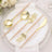Gold cutlery set with pink handles on elegant table setting.