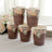 Set of five floral paper cups with a rustic wood design.