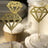 Gold glitter diamond cake toppers on cupcakes.