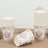 Floral design disposable paper cups stacked on a wooden surface.