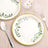 Elegant paper plates with green leafy design, perfect for parties or gatherings.