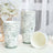 Floral patterned disposable cups stacked with one tipped over