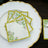 Decorative paper napkins with botanical design on a white plate.