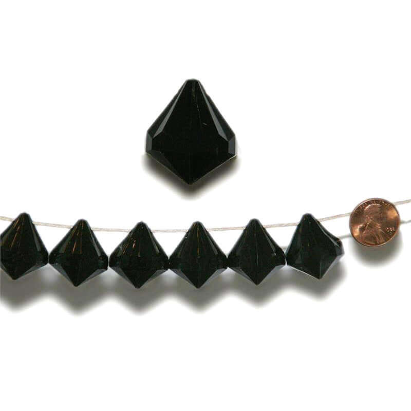 Black crystal pyramid beads on a string with a penny for scale. #whtbkgd