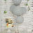 Gray balloons and a decorated cake for a birthday celebration.