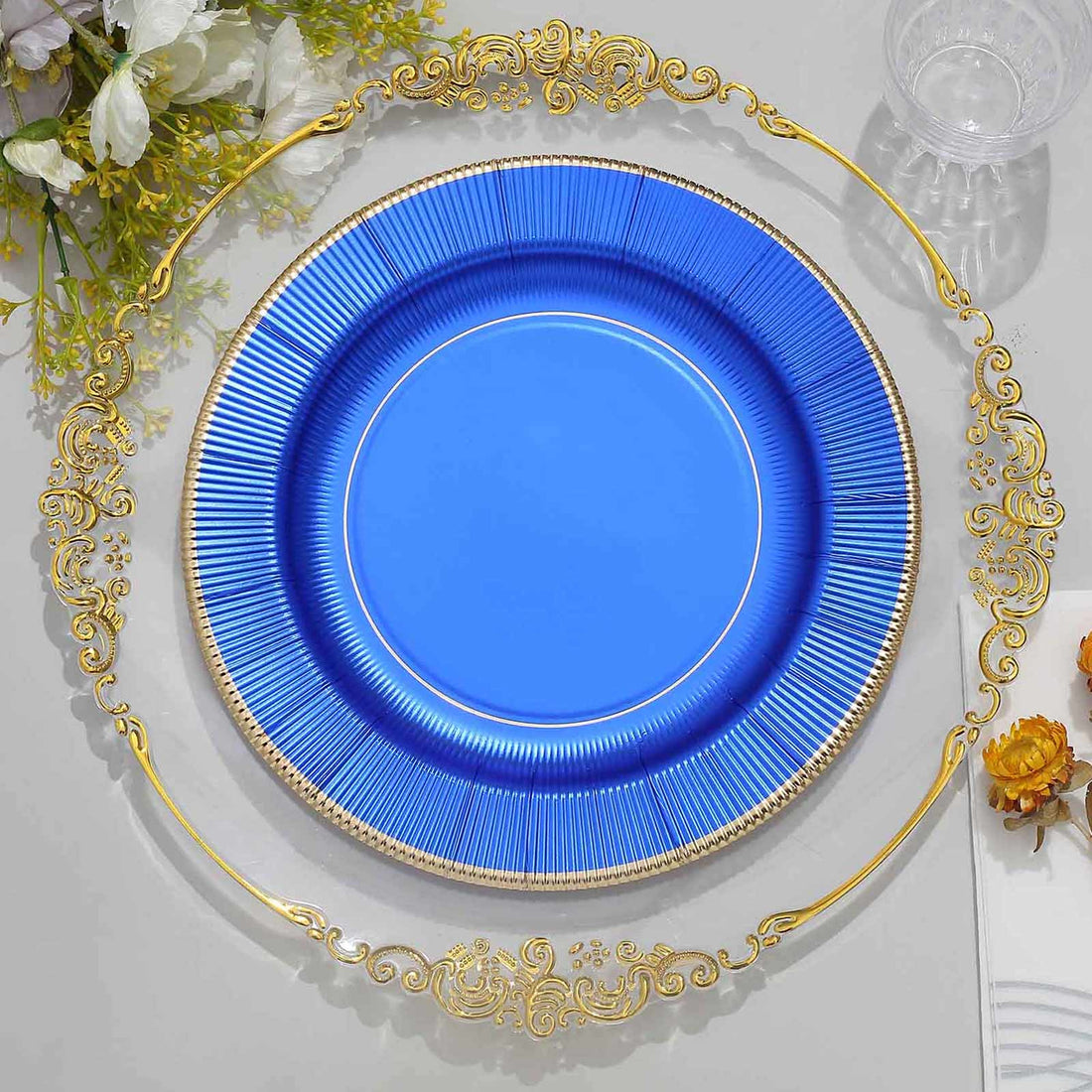 Blue decorative plate with gold trim on a white background