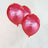 Red "Happy Birthday" balloons on strings