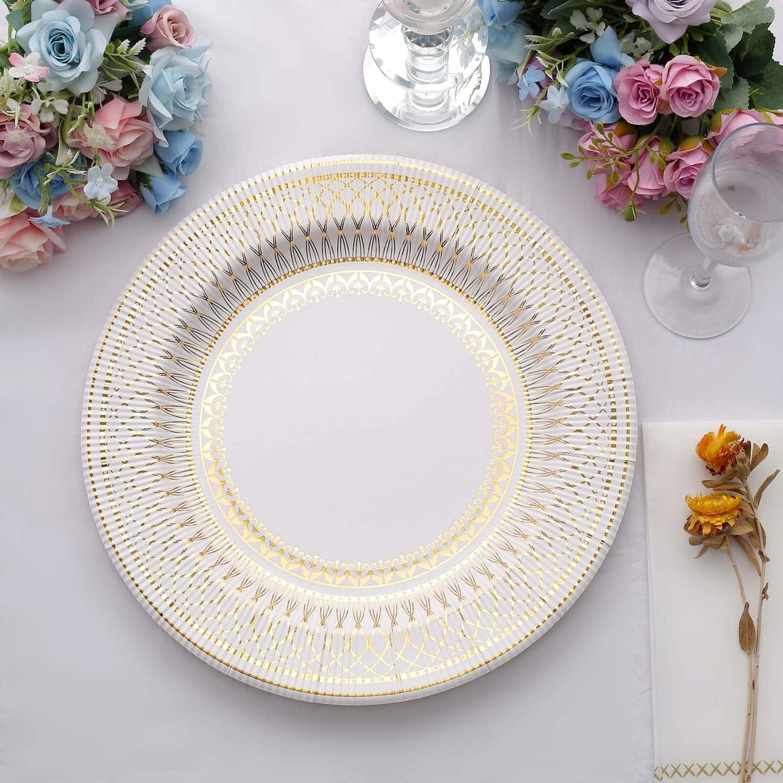 Elegant decorative plate with gold detailing on a white background.