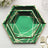 Hexagon-shaped green plates with gold geometric design on a white background.