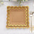 Scalloped edge disposable paper plates in brown with gold trim.